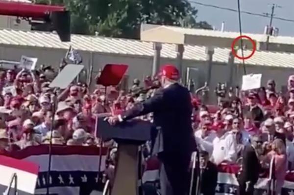 Video taken by shooting victim James Copenhaver shows a figure moving across a rooftop just minutes before gunfire rang out at Trump's rally in Butler, PA, July 13, 2024. 